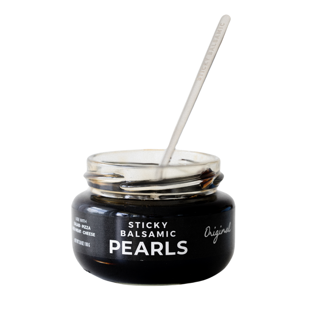 Balsamic pearls jar with stainless spoon; black label and “Original” text