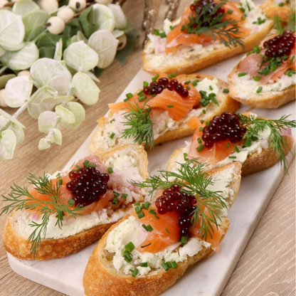 Sticky balsamic pearls starter collection crostini with salmon, dill, and dark pearl topping