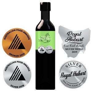 Balsamic vinegar bottle with green Sticky Balsamic label and black cap