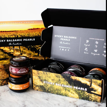 Sticky balsamic pearls gift box open with assorted jars and bottles for gifting