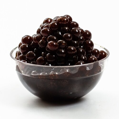 Clear bowl filled with dark balsamic pearls
