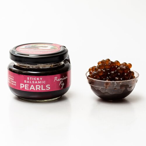 Sticky balsamic pearls jar with black glass container and pink label
