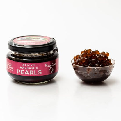 Sticky balsamic pearls jar with black glass container and pink label