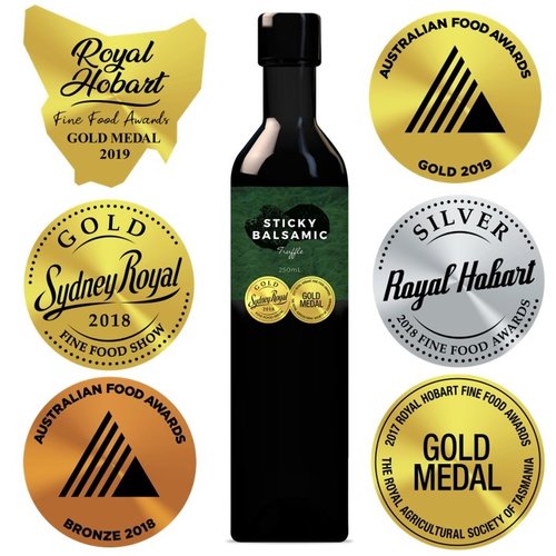 Sticky balsamic bottle with gold and silver award seals and green label